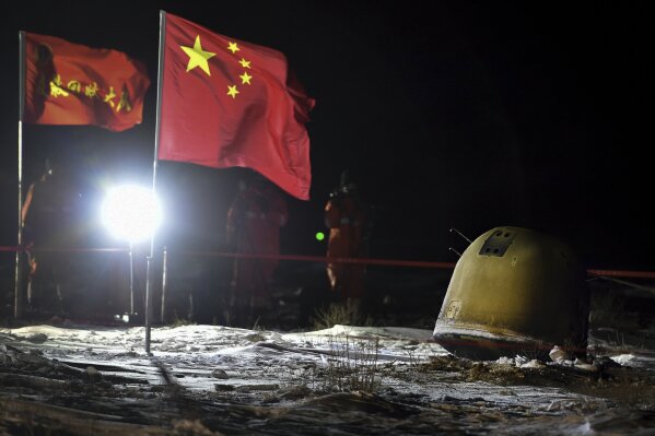 Chinese capsule returns to Earth carrying moon rocks | AP News